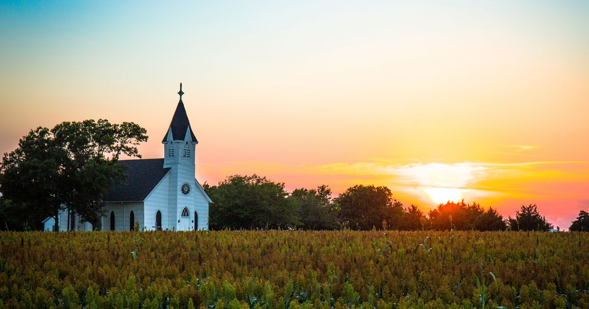 A Representation Of A Churches That May Be Looking To Support Missionaries | Church In A Field With A Sunset Backdrop | Servants Of Christ