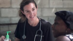 Missionary nurse helping child